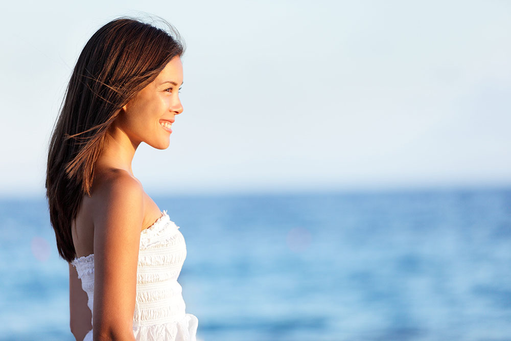 smiling young woman on the beach
