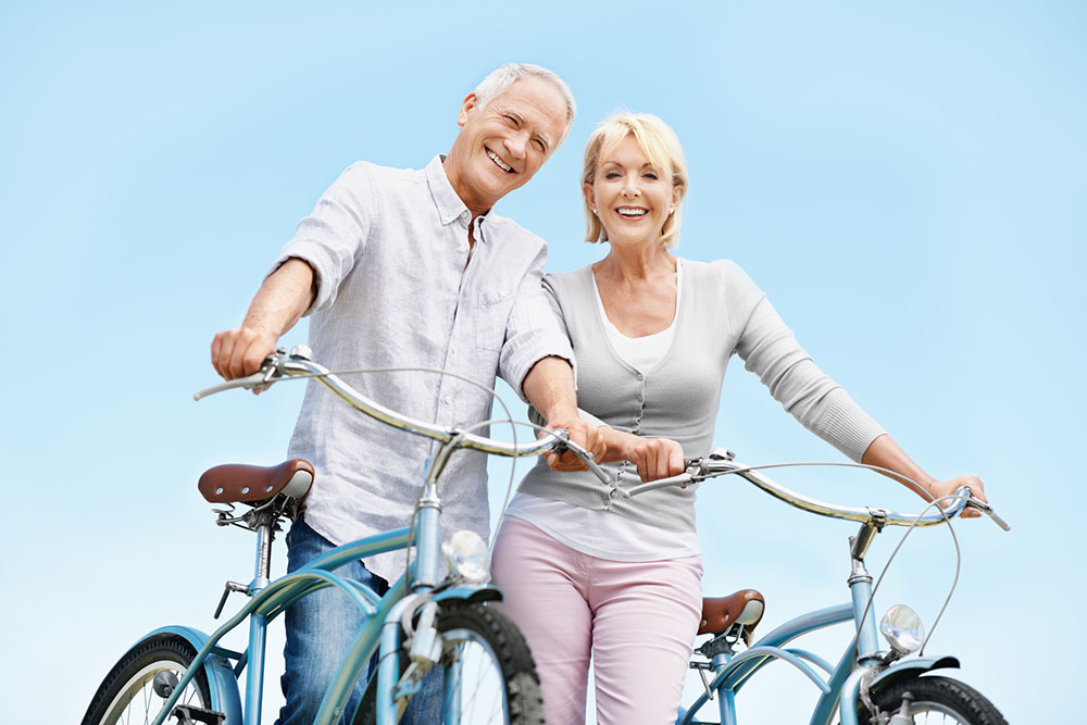 smiling seniors out for a bike ride